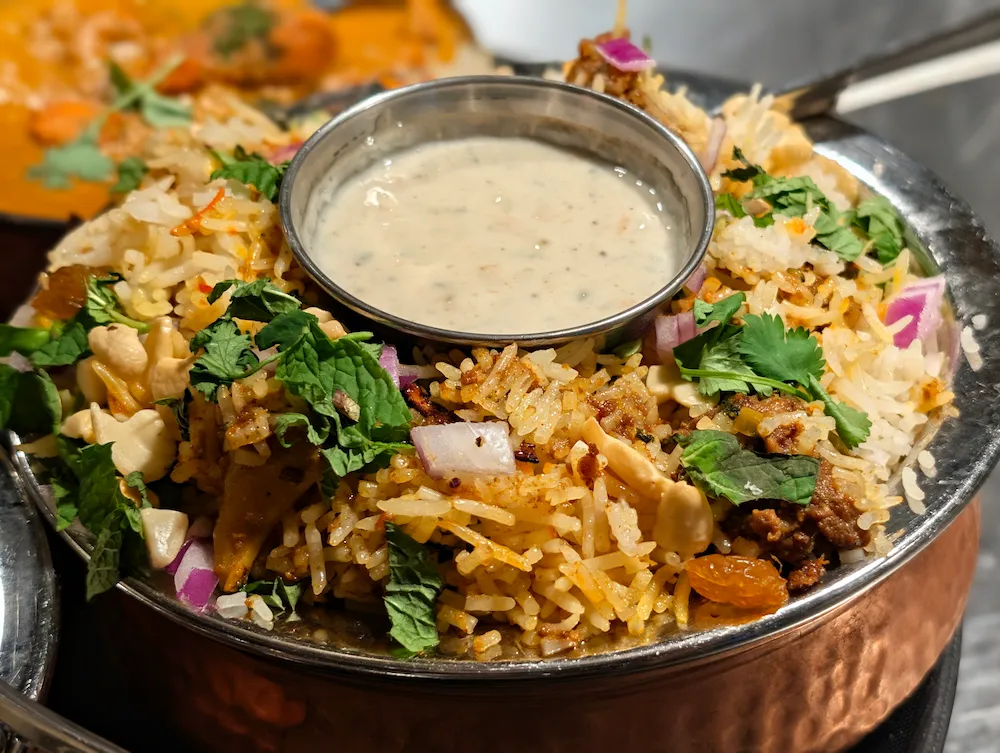 Biryani – Aromatic basmati rice layered with tender spiced meat or vegetables, slow-cooked | SPICE ROOM Denver