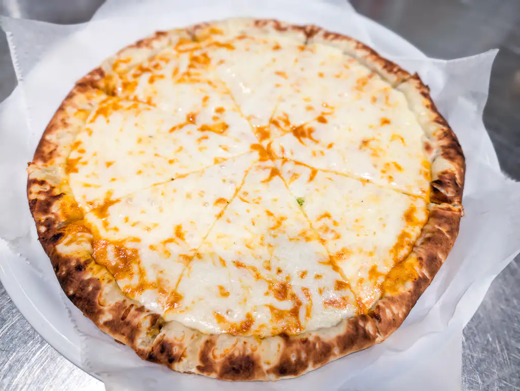 Cheese Pizza – Classic cheese pizza with our signature blend of spices on a naan crust | SPICE ROOM Denver