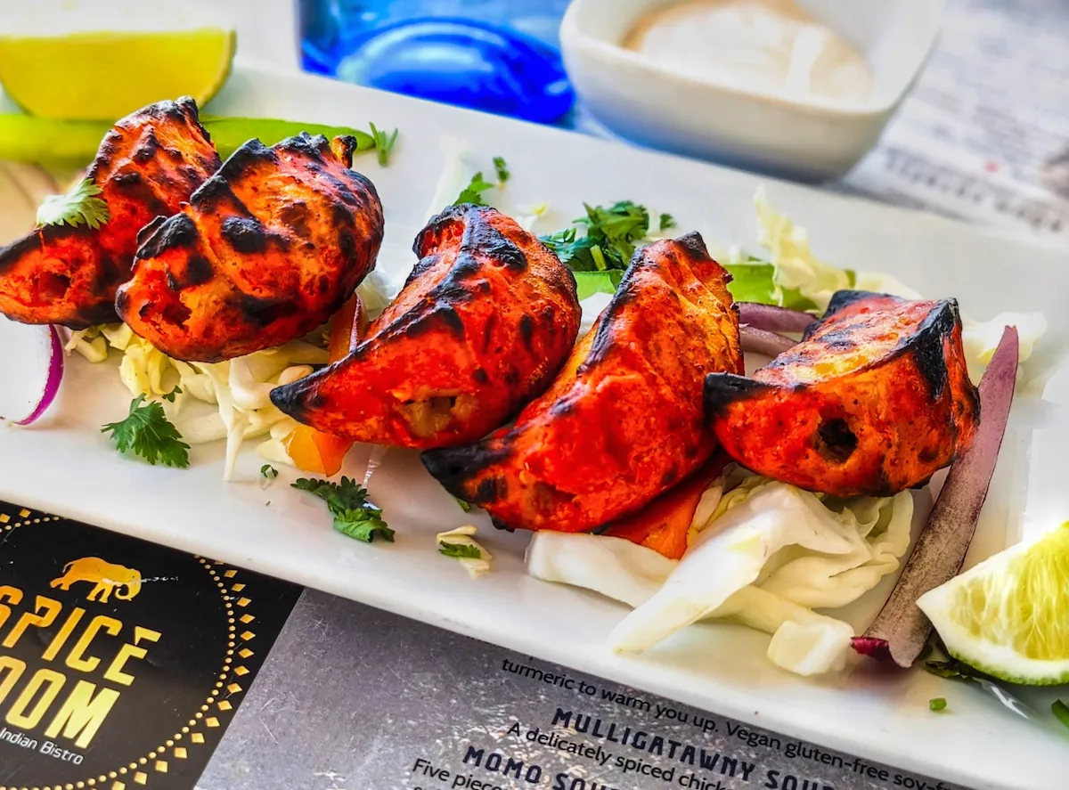 Tandoori Chicken Momo – Himalayan dumplings stuffed with spiced chicken, char-grilled in the tandoor | SPICE ROOM Denver