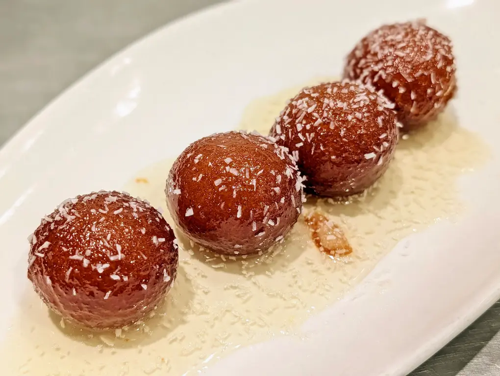 Gulab Jamun – Golden milk-solid dumplings soaked in rose-cardamom syrup — served warm | SPICE ROOM Denver