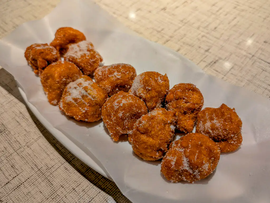 Gulab Jamun (Sugar-Dusted) – Golden gulab jamun finished with a light dusting of powdered sugar | SPICE ROOM Denver