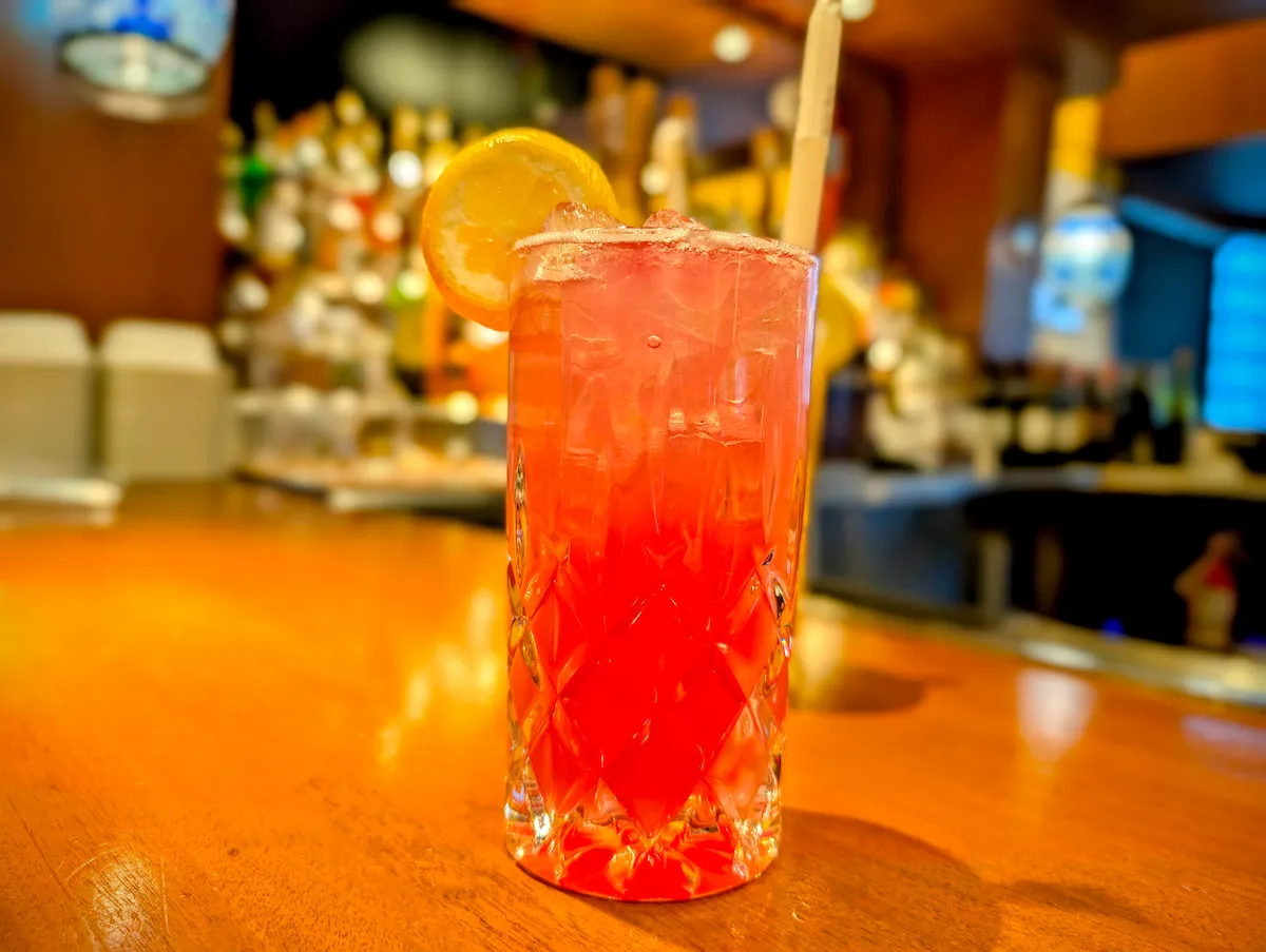 Huckleberry Fizz – Sweet, tart & bubbly with a lemon twist | SPICE ROOM Denver happy hour