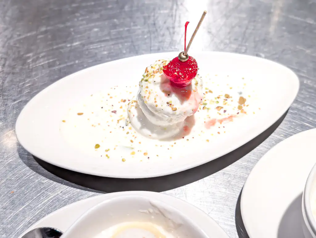 Kulfi – Traditional Indian ice cream — dense, creamy, and infused with cardamom and pistachio | SPICE ROOM Denver