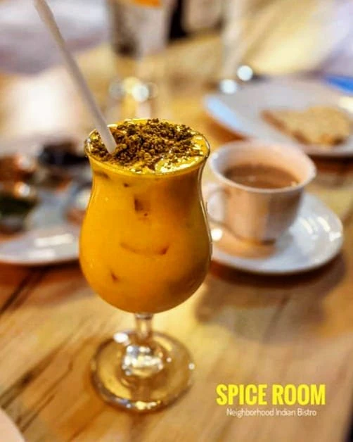 Mango Lassi – Creamy yogurt blended with fresh mango | SPICE ROOM Denver happy hour