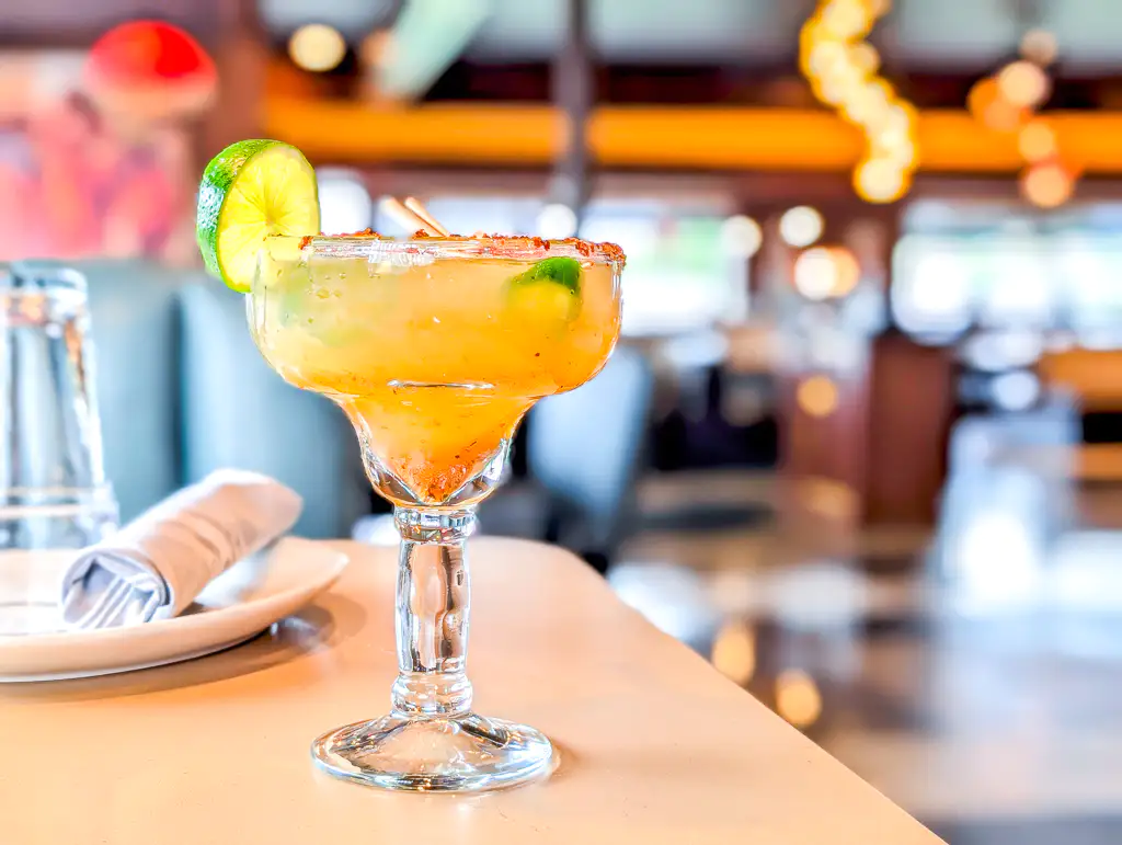 Mango Margarita – Tropical mango blended with tequila, lime, and a hint of chili salt | SPICE ROOM Denver
