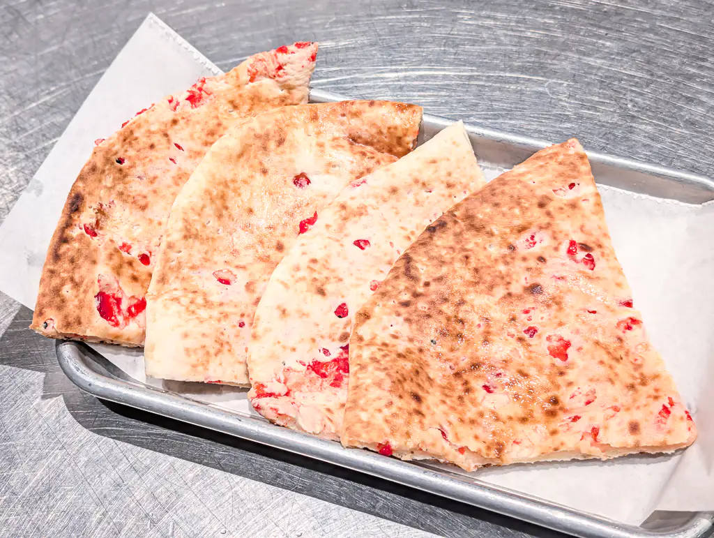 Paneer Kulcha – Stuffed tandoori bread filled with seasoned paneer and fresh herbs | SPICE ROOM Denver