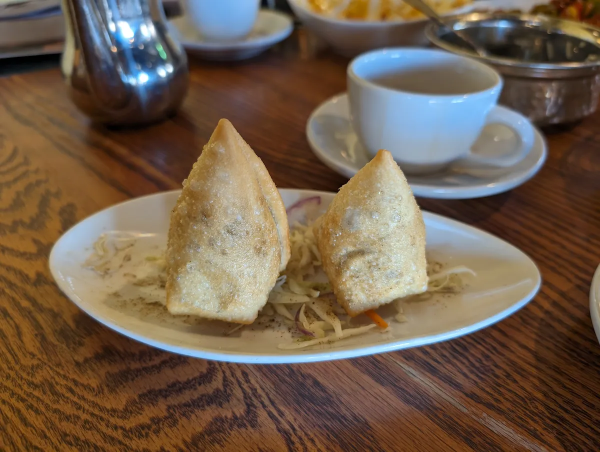 Vegetable Samosa – Deep-fried savory pastries stuffed with spiced potato & peas. | SPICE ROOM Denver happy hour