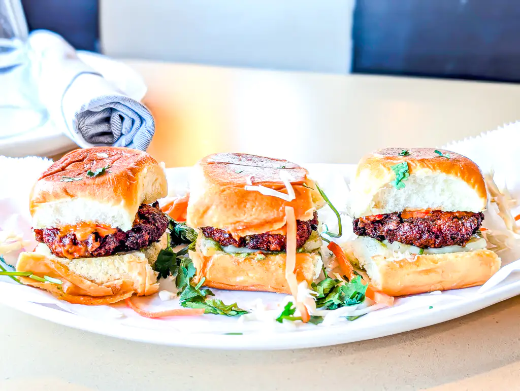 Tikka Sliders – Mini brioche buns filled with spiced tikka, slaw, and mint chutney | SPICE ROOM Denver