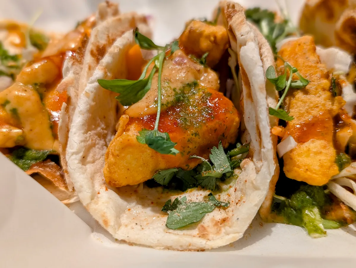 Tikka Tacos – Naan tacos stuffed with spiced paneer tikka, cilantro chutney, and microgreens | SPICE ROOM Denver
