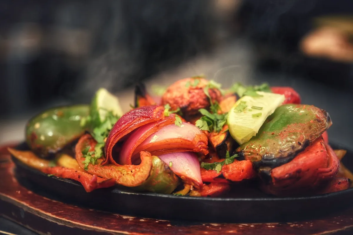 Vegetable Tandoori – Smoky char-grilled vegetables with vibrant spices, served sizzling hot | SPICE ROOM Denver