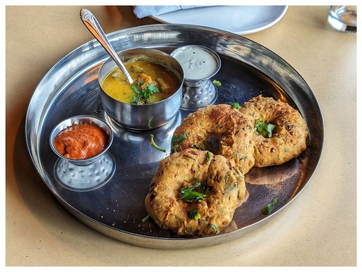 Medu Vada — Golden, crispy donut-shaped fritters made from urad dal batt